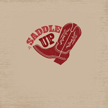 Saddle Up graphic with red cowboy boots on a rustic cream wood background
