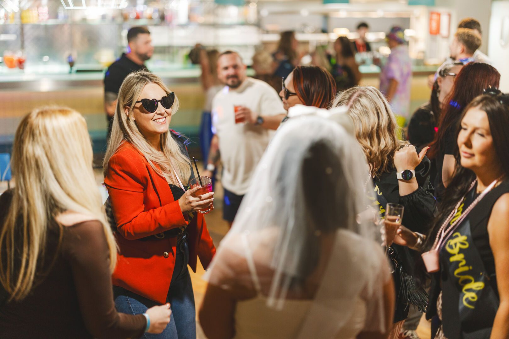 A group of friends talk amongst themselves during Bottomless Brunch at Minehead resort.
