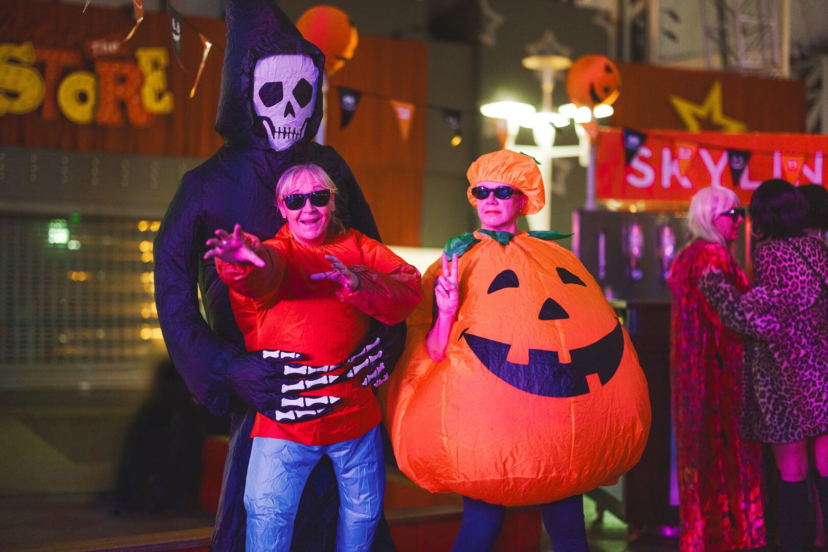 An image of three people in Halloween-themed fancy dress for a Butlin's Big Weekender.