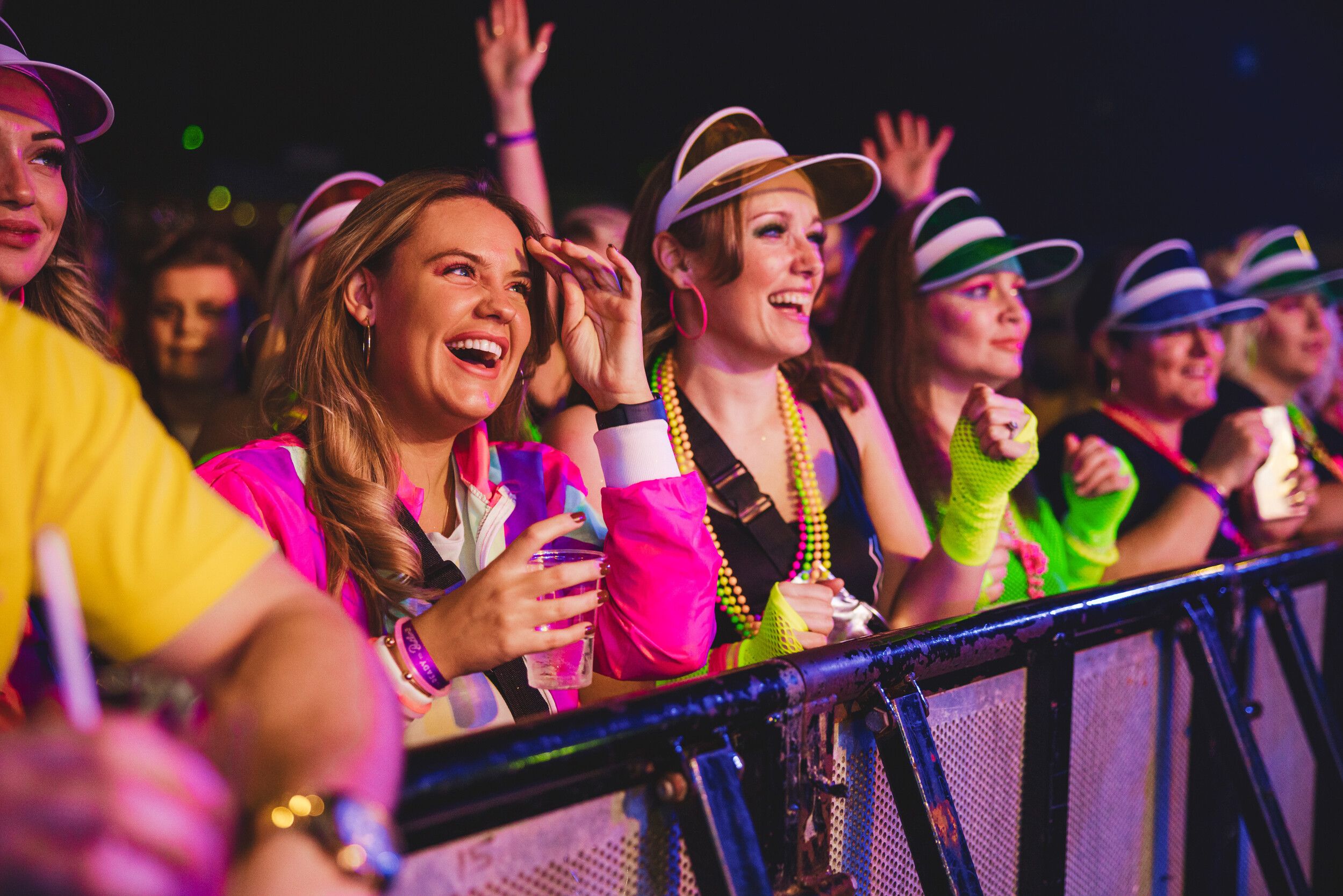 A group of friends at the front of the barrier during a Big Weekenders performance.