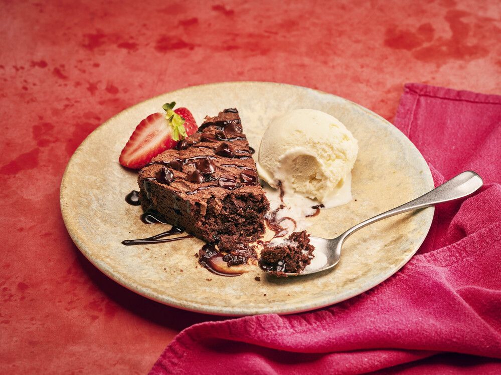 A photo of a dessert, served with ice cream and strawberries at the Firehouse Grill.