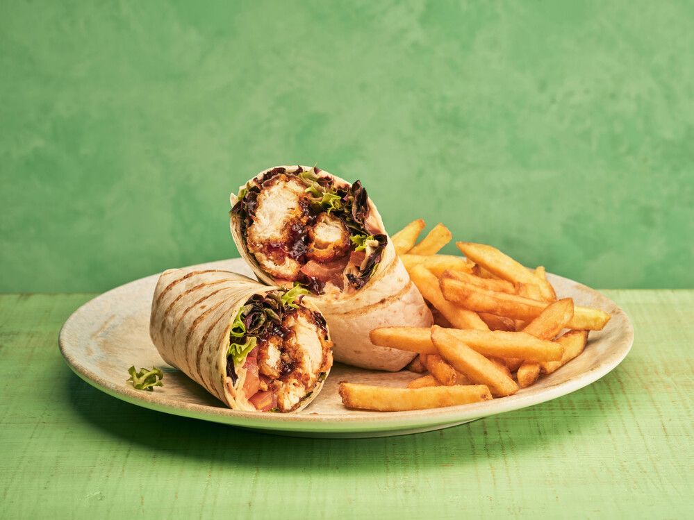 A chicken wrap served with chips at the Firehouse Grill.