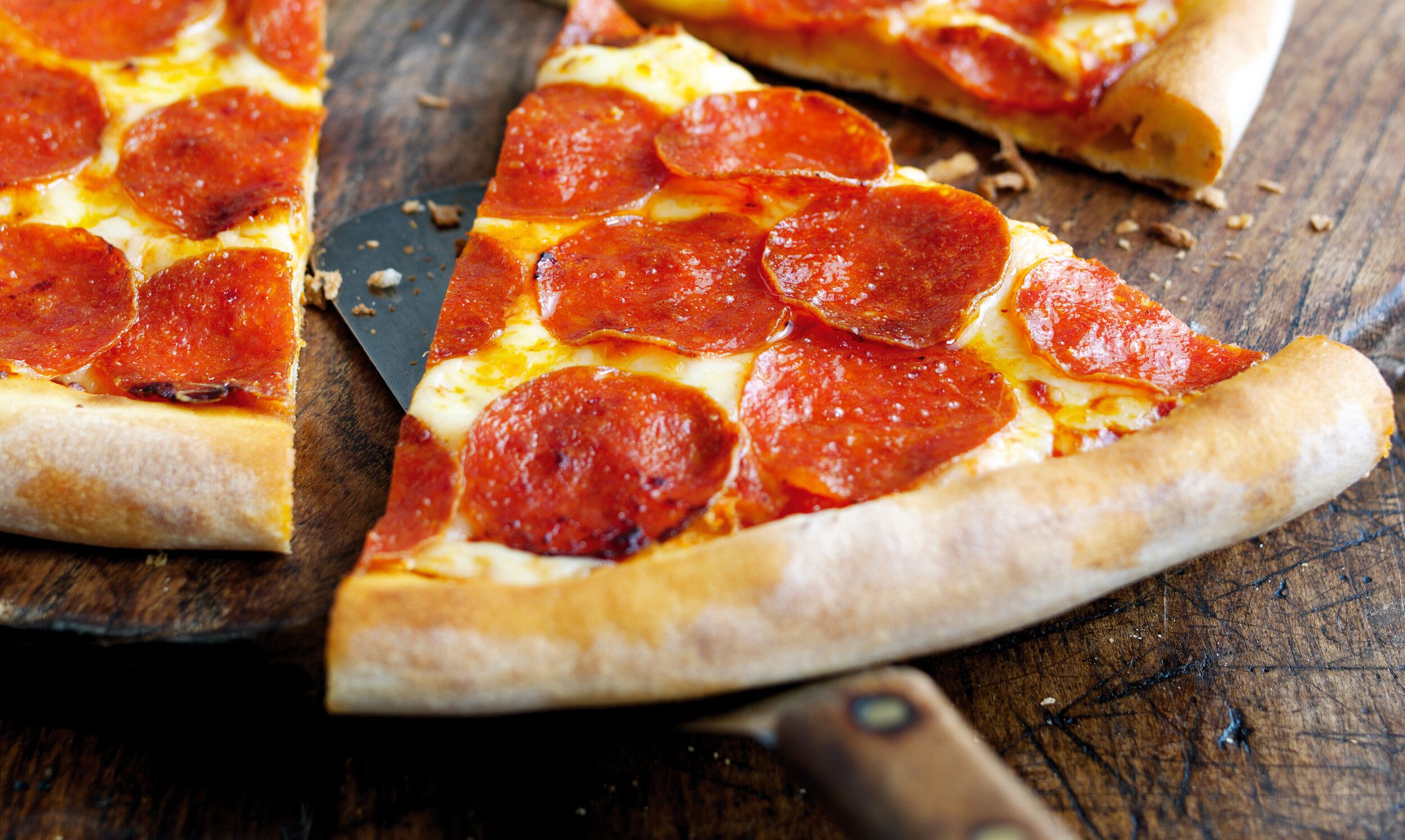 A slice of pepperoni pizza.