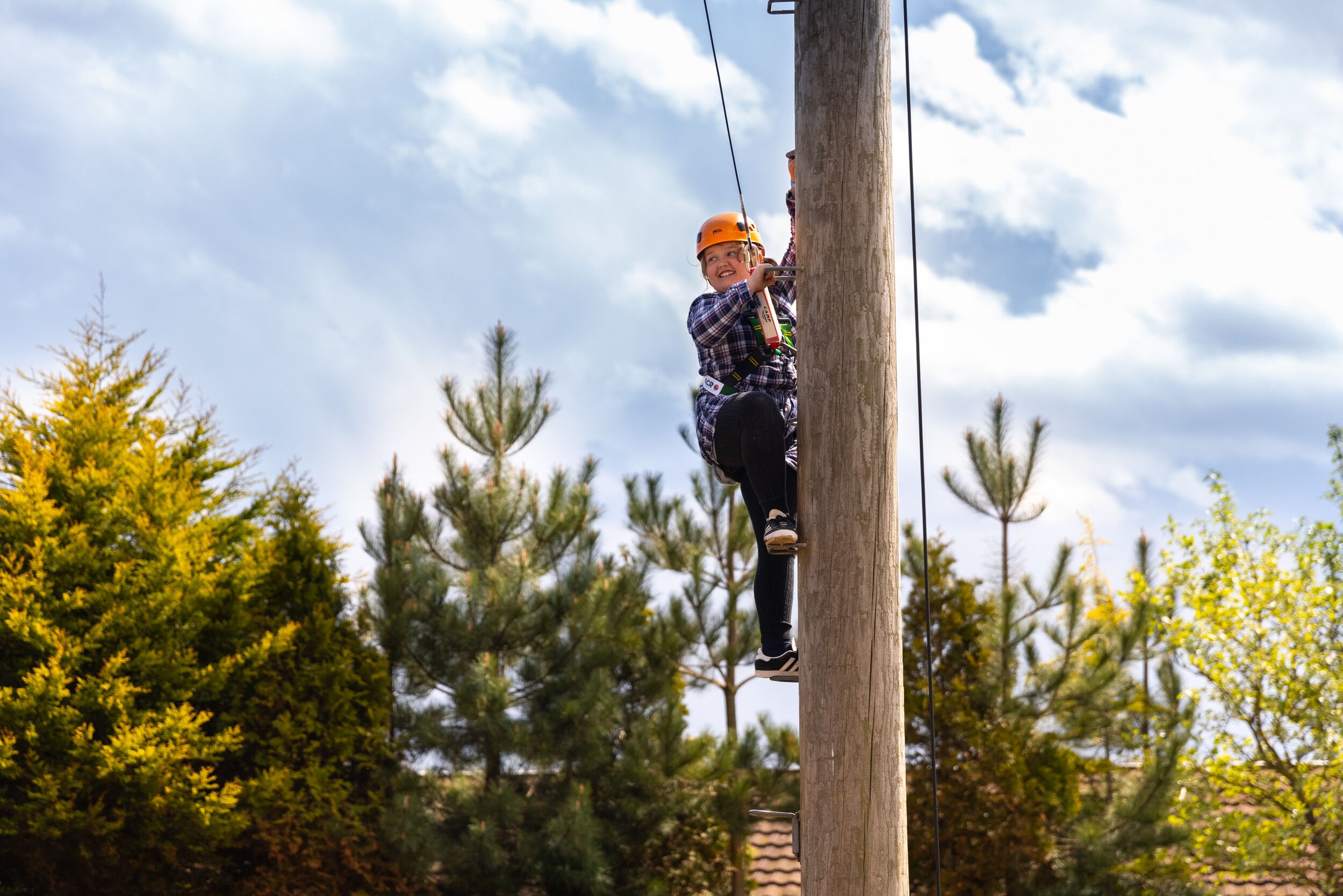 A child climbing up a ladder for a freefall.
