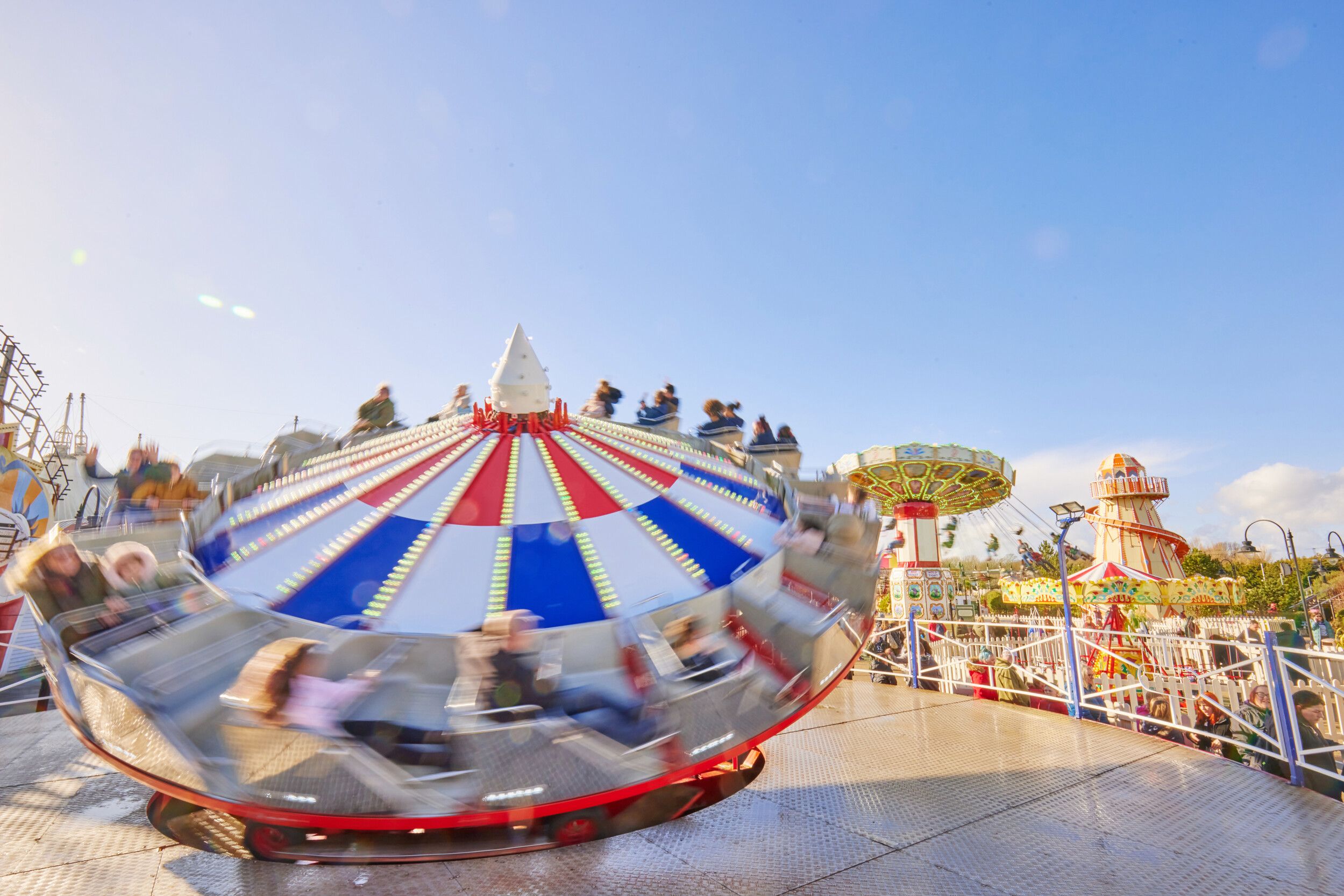 Several guests ride the Trabant fairground ride at Bognor Regis.