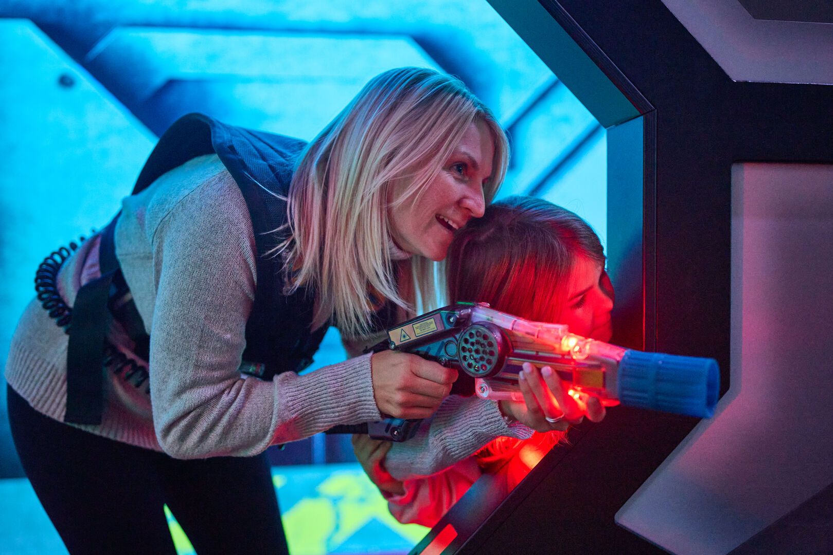 A woman plays Laser Tag with her daughter at Playxperience.