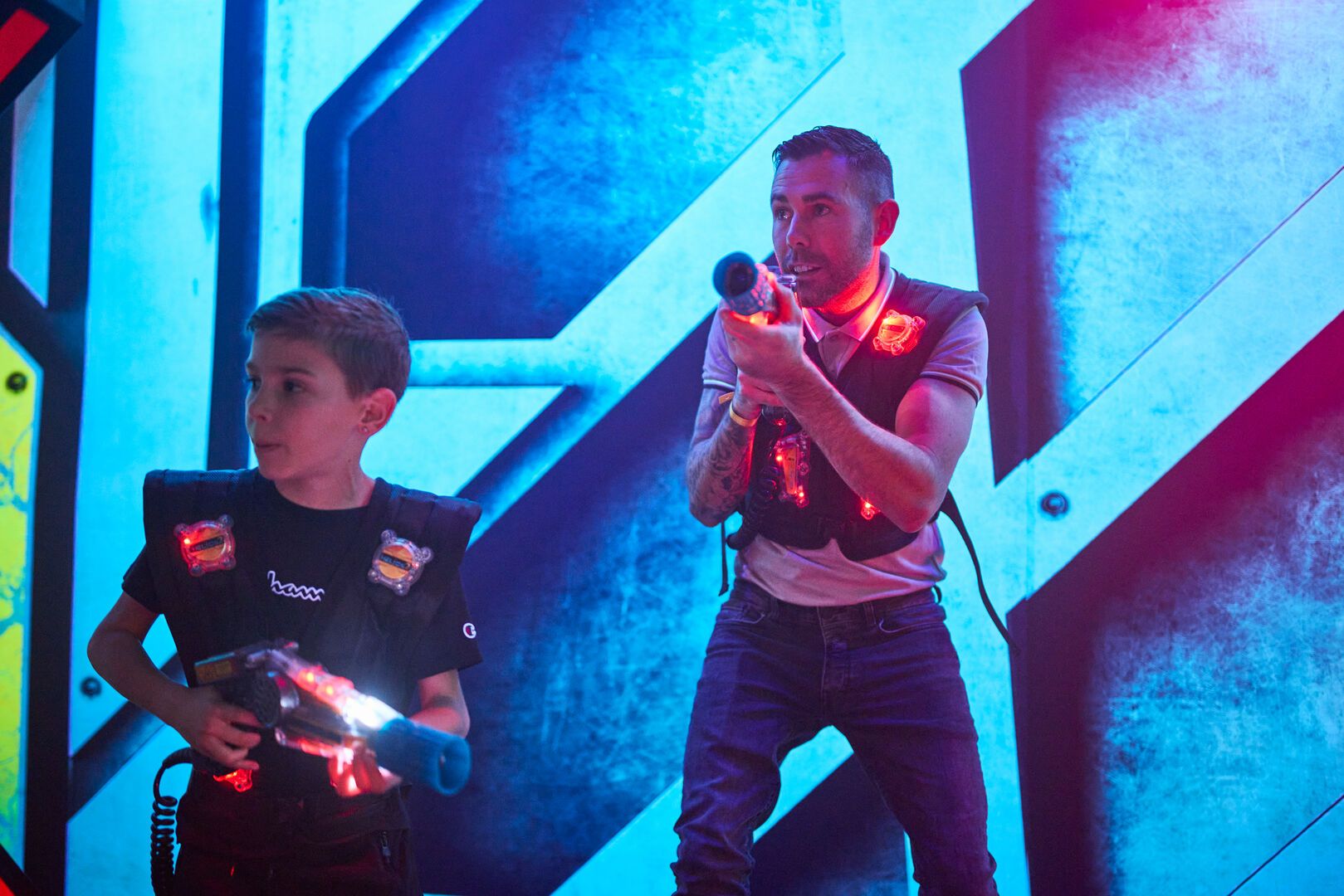A father and son play Laser Tag together at Playxperience.