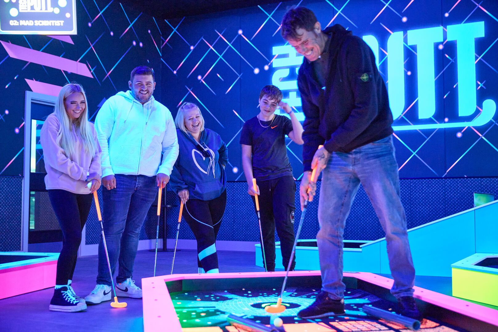 A family play Tech Putt together at Playxperience in Bognor Regis.