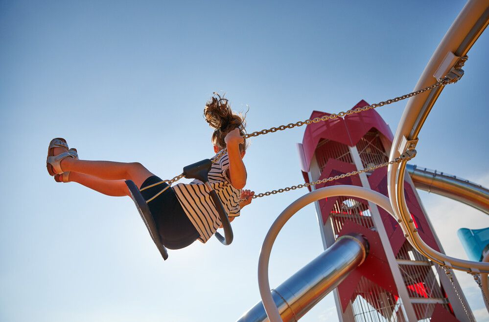 A photo of a young girl on a swing at Minehead Skypark.