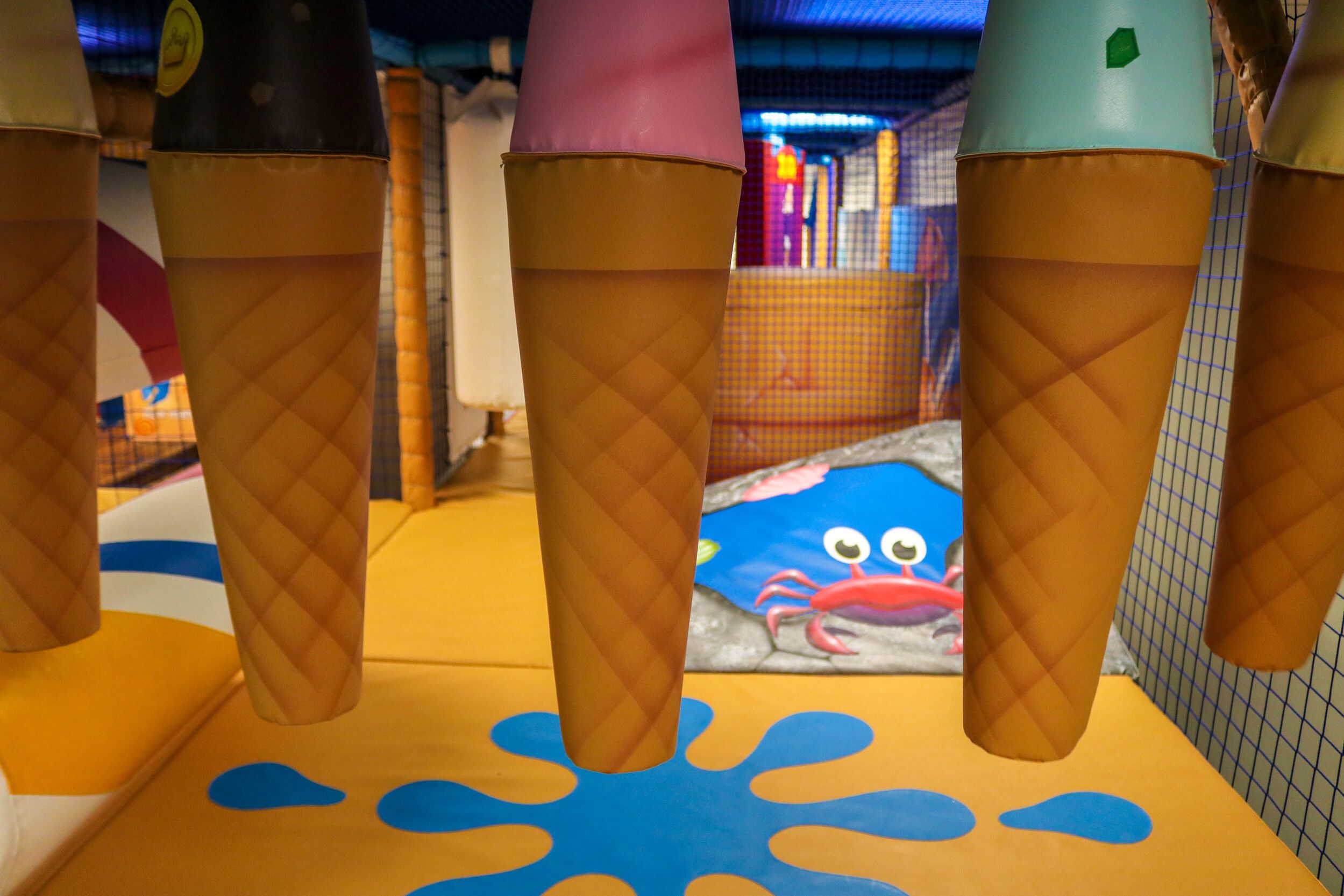 An indoor play area with colourful designs.