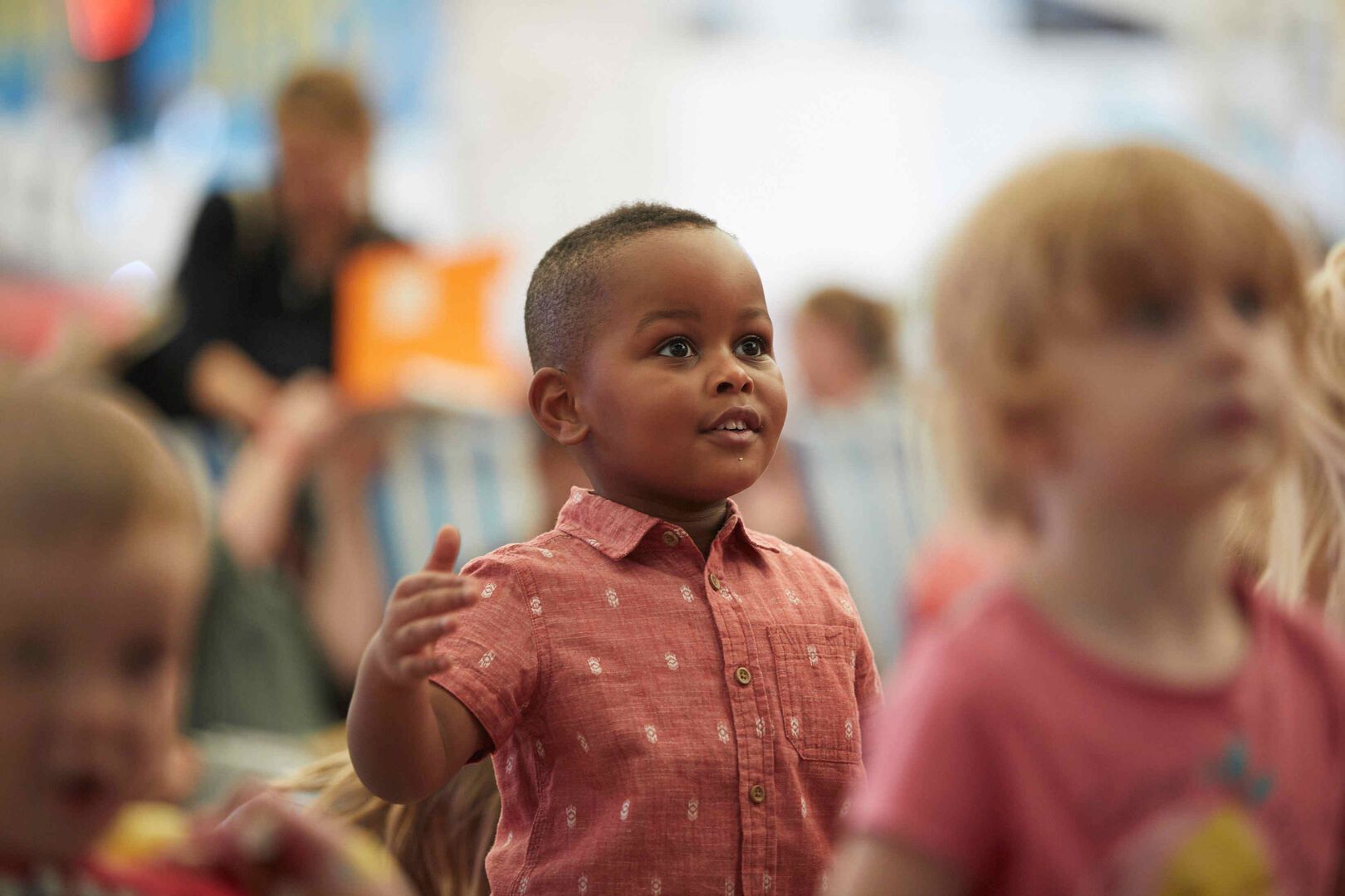 A young boy enjoying the Tots Disco at Butlin's.