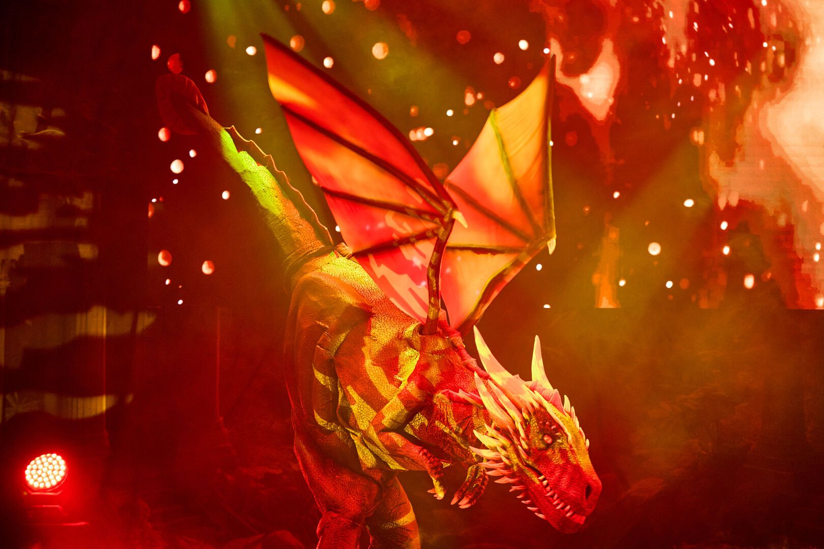 A large man-made dragon stands at the centre of the stage for the Animals and Mythical Beasts show at Butlin's.