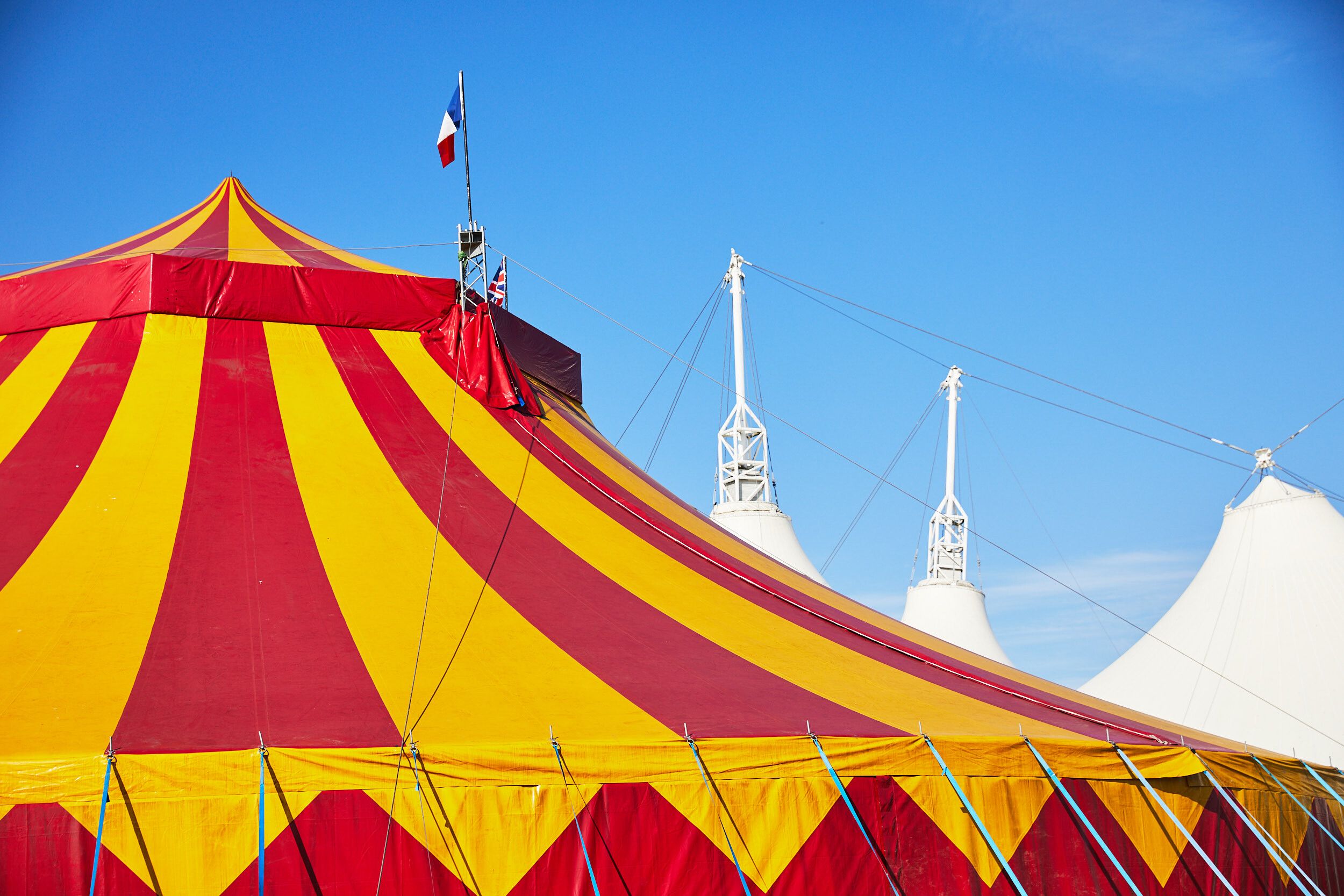 A red and yellow big top in front of Skyline Pavilion.