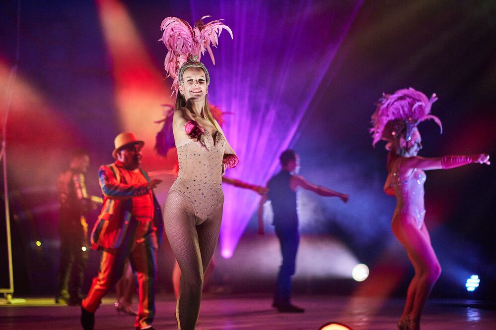 Performers on stage for Big Top Circus in elaborate outfits.