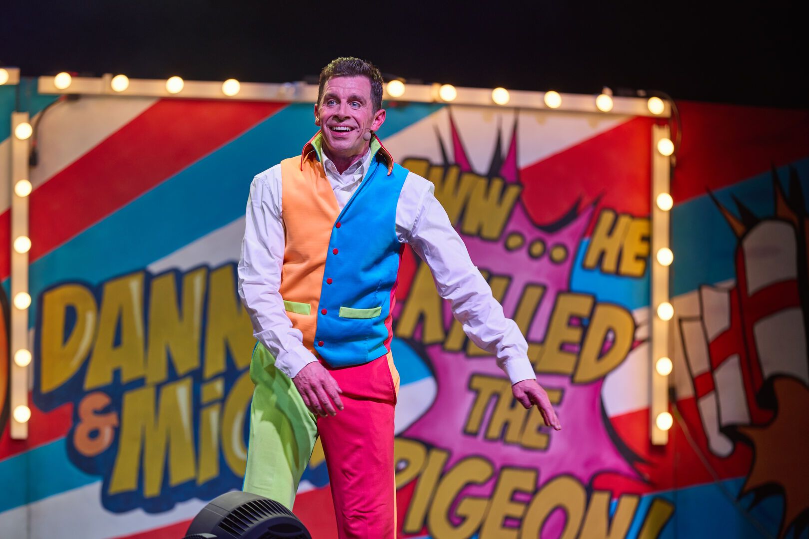 Danny Webb performs on stage for Cirque Du Hilarious.