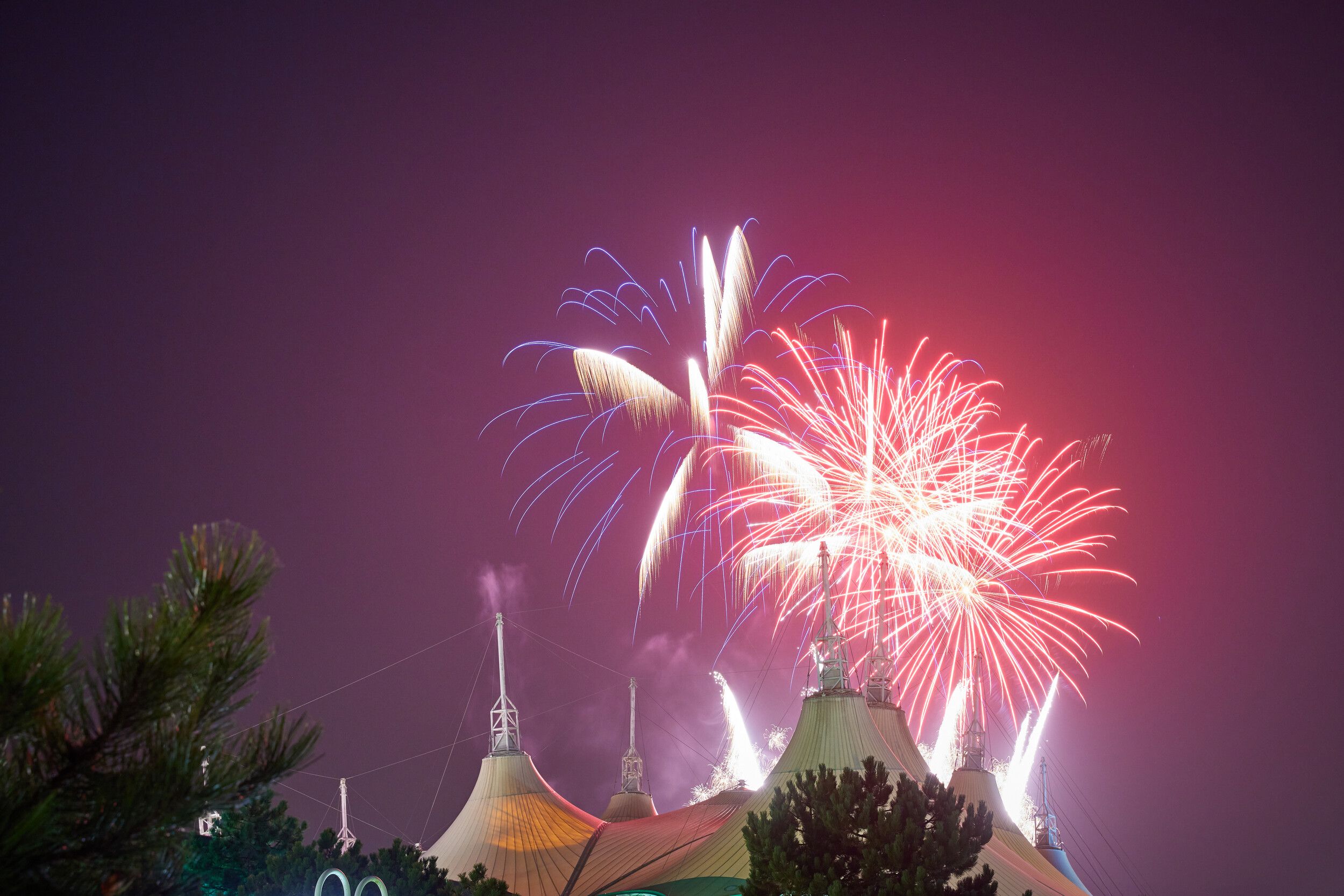 A view of the fireworks above the Skyline Pavilion at night.