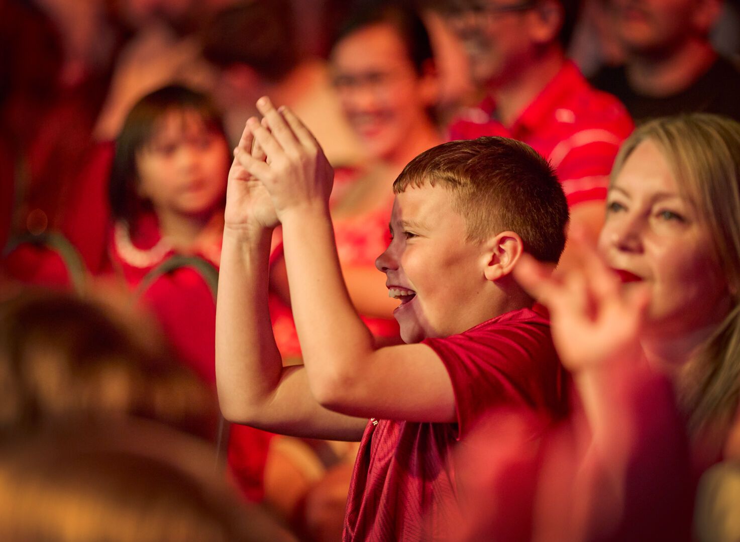 A close-up of a young boy enjoying the Maximum Pro Wrestling show at Butlin's.