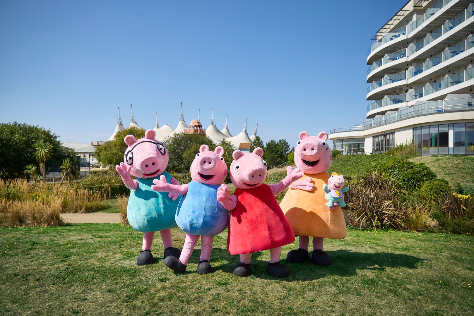 Peppa Pig and her family pose for the camera while on resort at Butlin's.