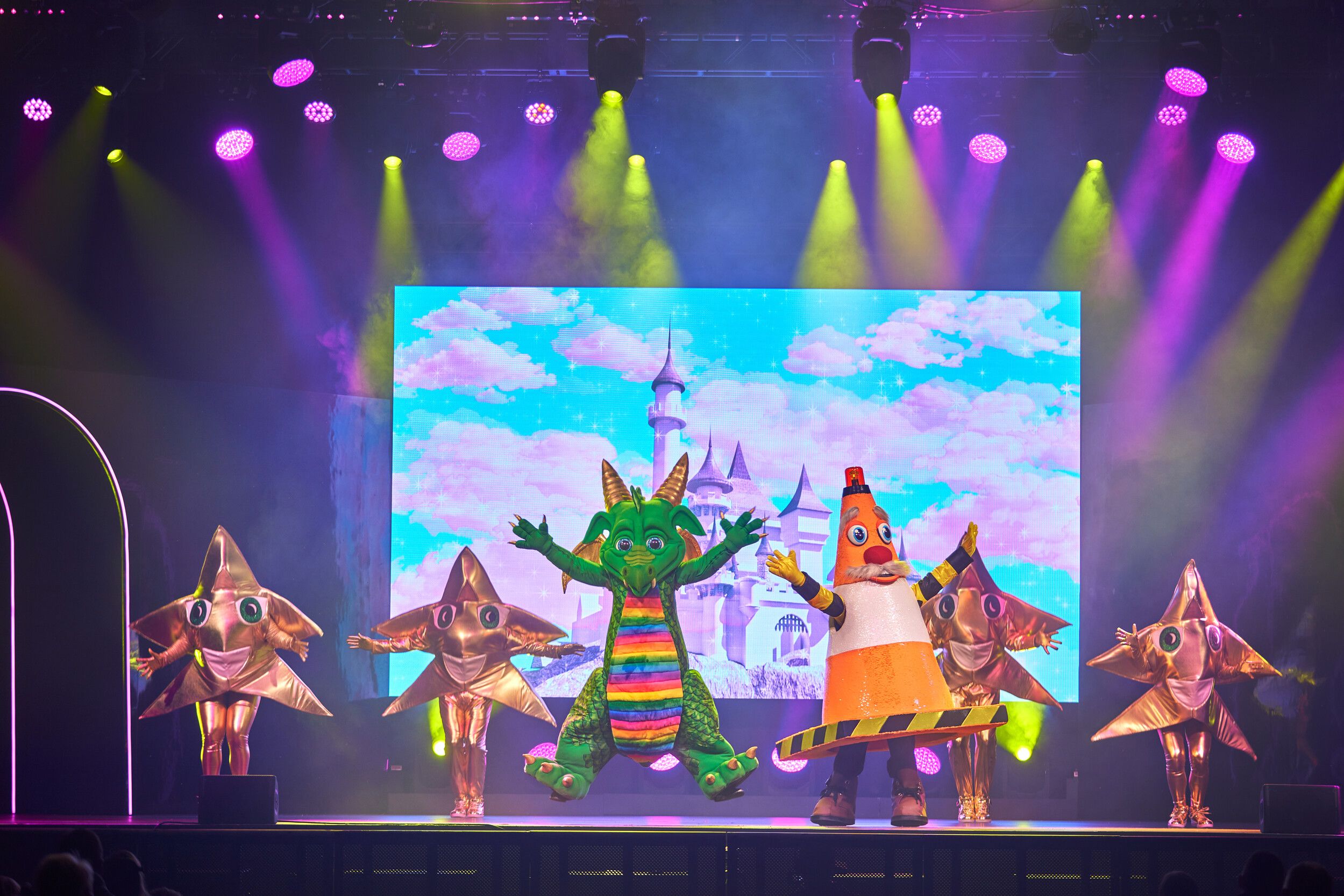 Dragon performs on stage alongside Traffic Cone during a live performance of The Masked Singer.