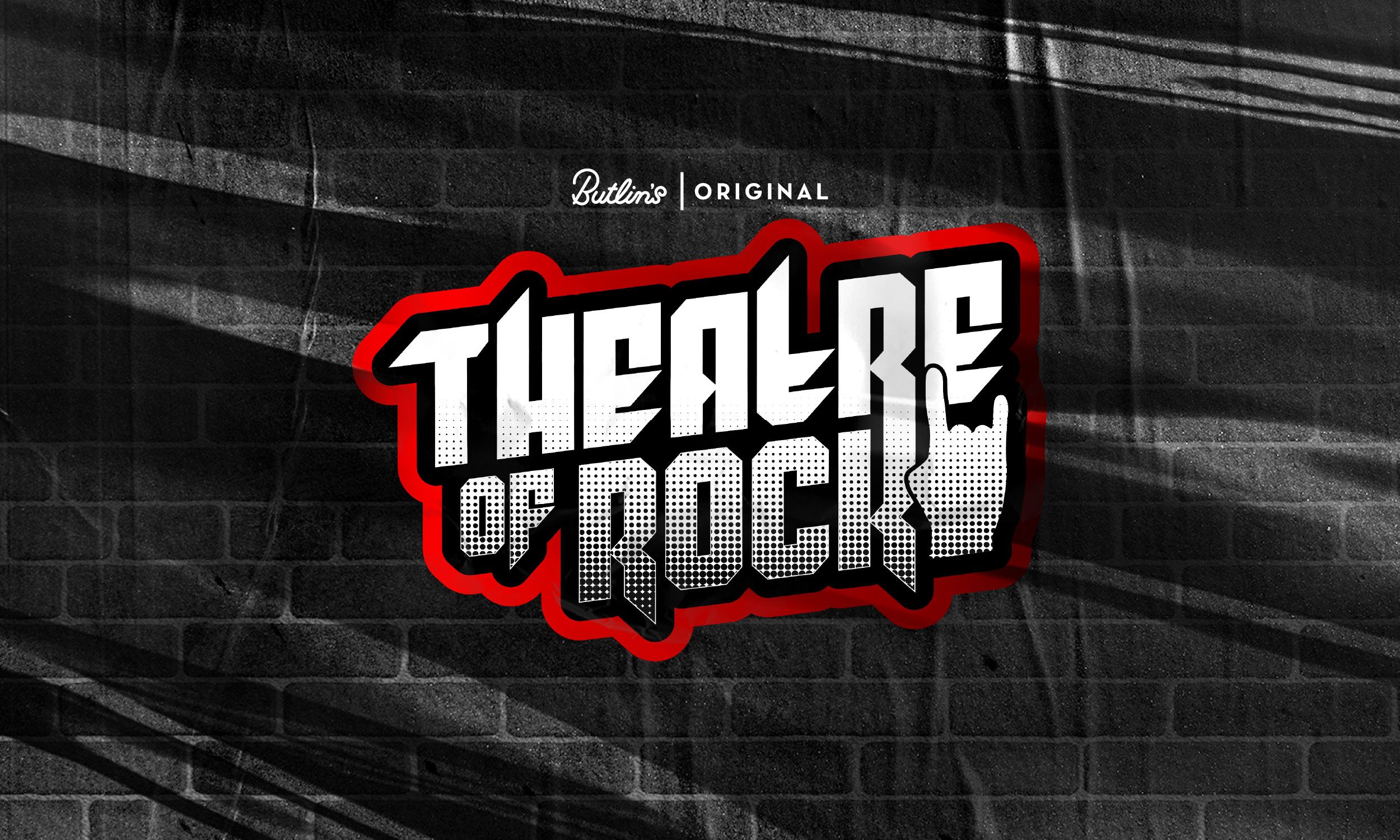 A promotional image for the Theatre of Rock 2026 show. The background features a wall cast in shadows with the the show name at the centre, written in bold white lettering with a black and red outline. A rock hand-sign appears next to it, and the words "Butlin's original" can be seen above the title.
