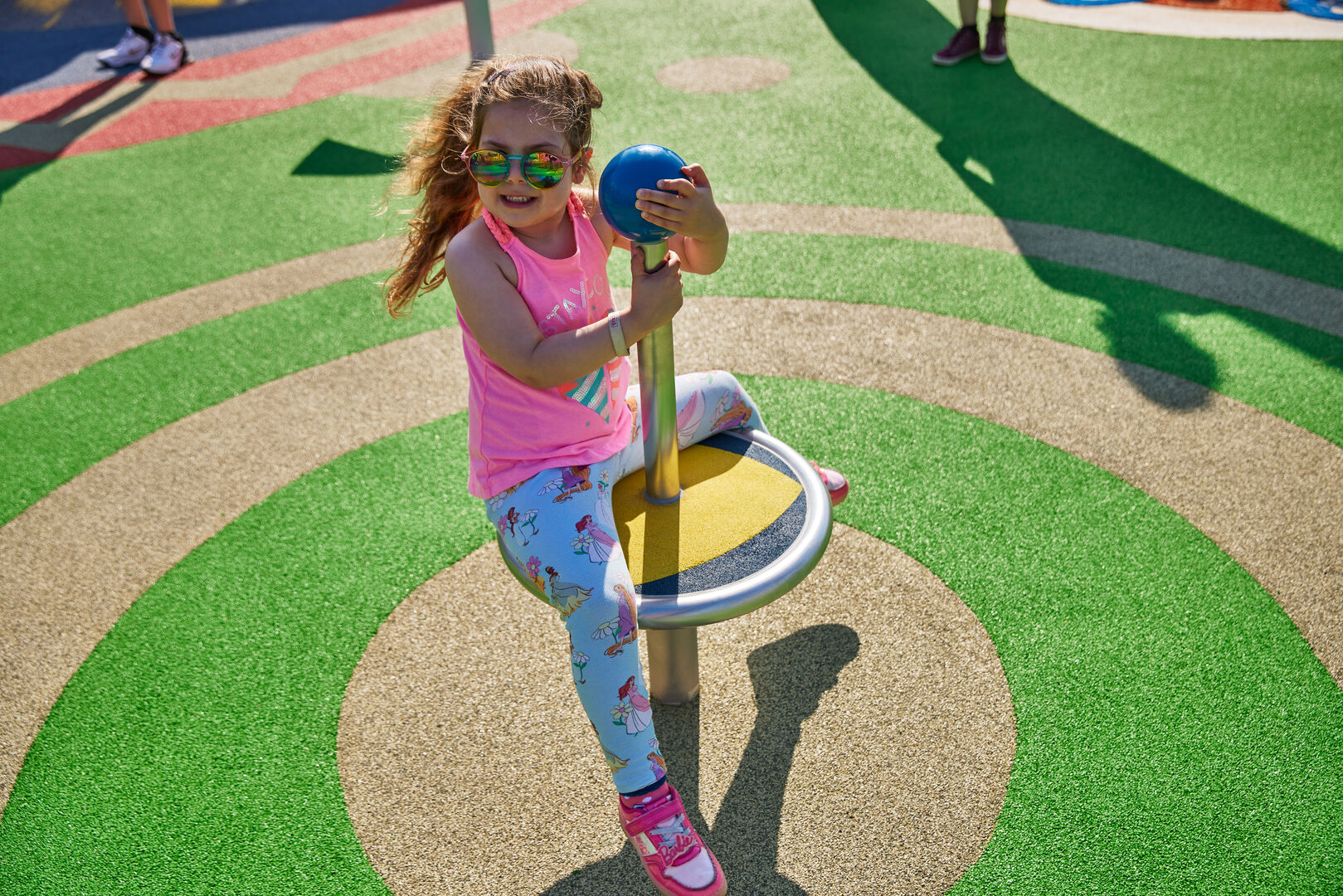 A close-up of a young girl playing at the Skypark.
